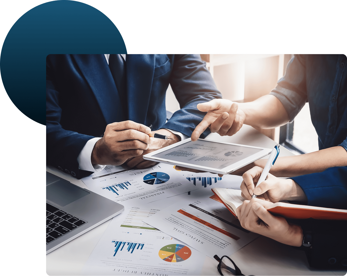 Business meeting reviewing charts and graphs.
